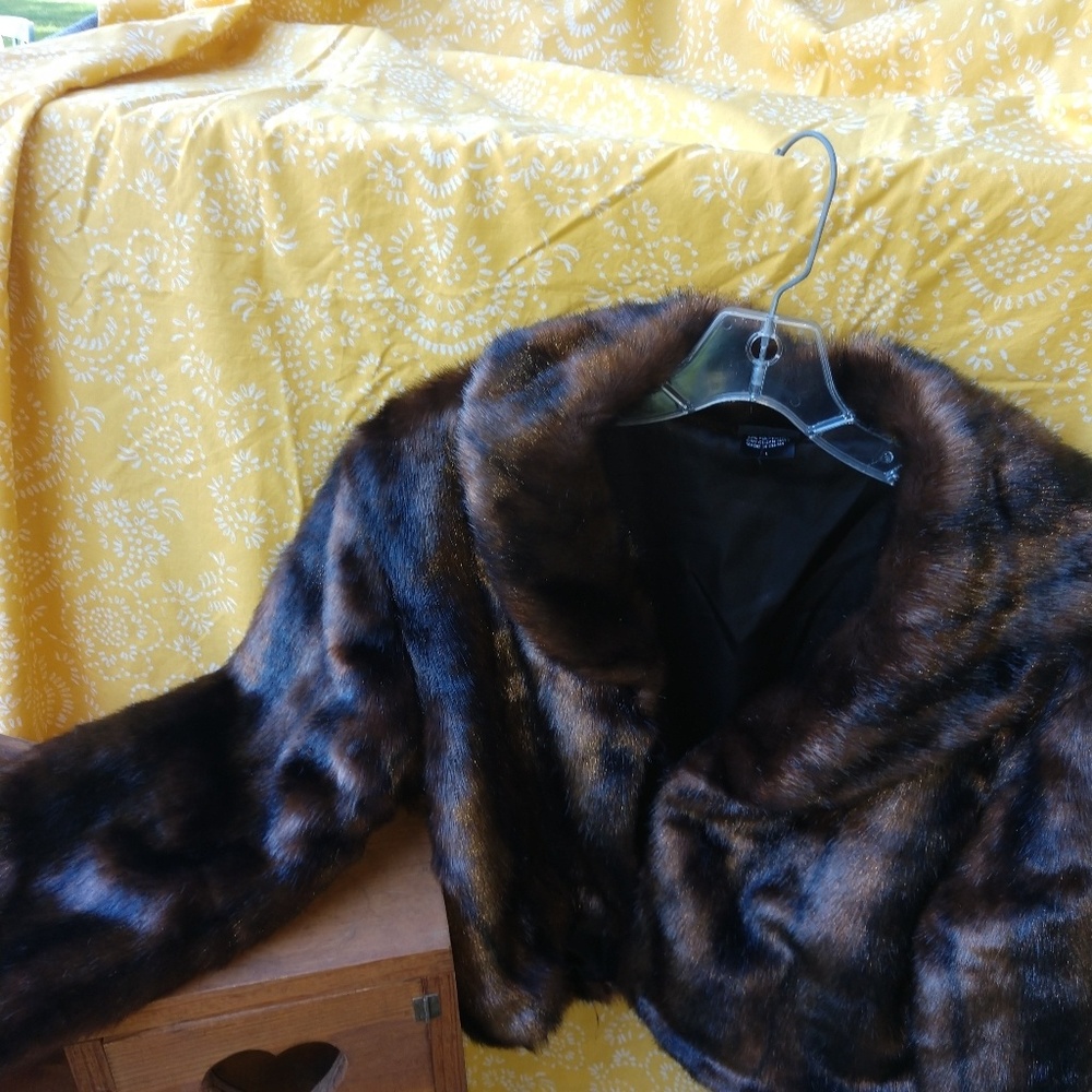 Faux fur waist coat.